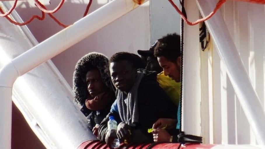 northafricanmigrantswaitingtodisembarkfromarescuevesselinthesouthernitaliancityoftarantoansa
