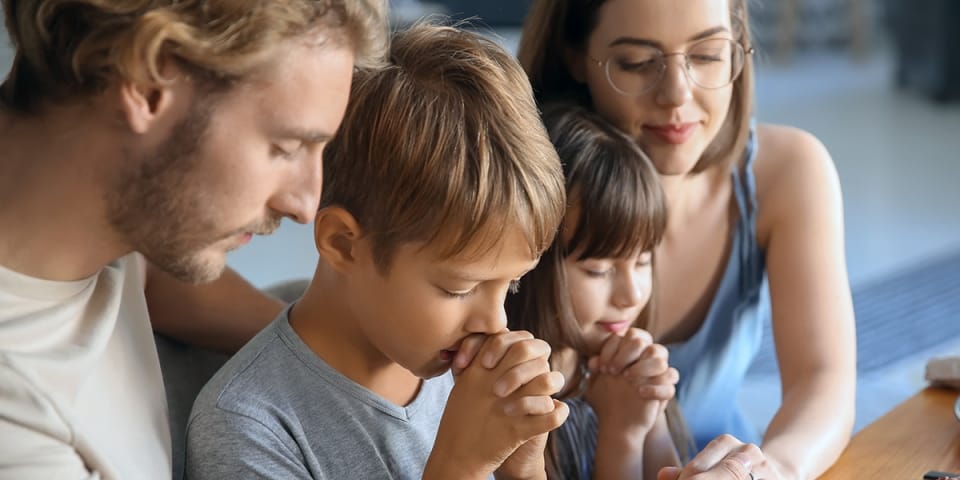 familypraytogetherhomefathermotherchildshutterstock1310080675