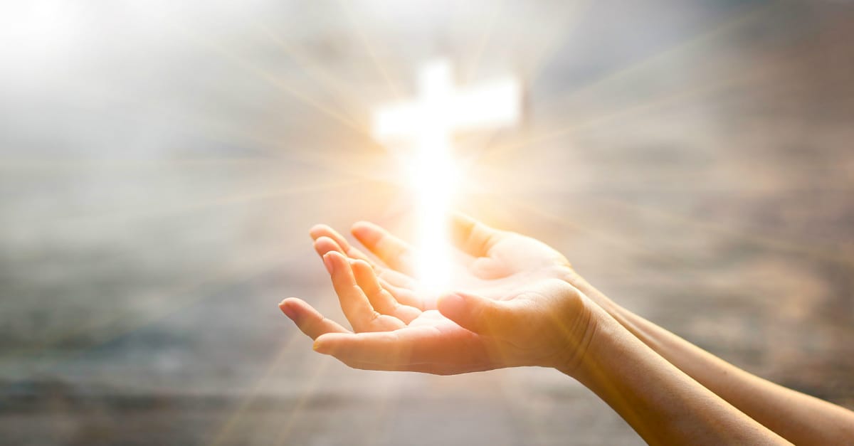 6538womanhandsopeninpraiseglowingcrossgett
