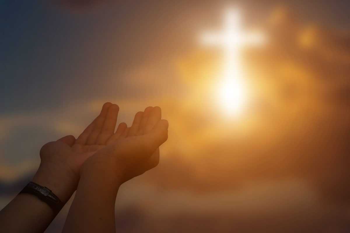 silhouetteofchristianopenhandstoprayingforblessingfromgodatsunsetbackgroundt20om72j8scaled